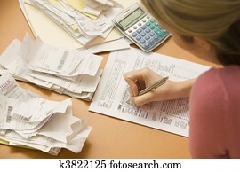 Woman Filling Out Tax Form Woman Filling Out Tax Form