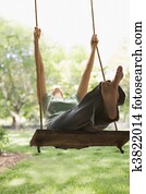 Woman Swinging on Swing