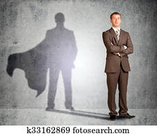 Businessman with superman shadow Businessman with superman shadow