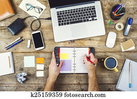 Desktop mix on a wooden office table.