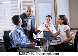 Manager meeting with office workers, directing Manager meeting with office workers, directing