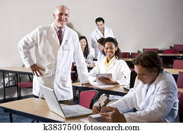 Professor with medical students in classroom