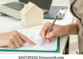Client Signs Document to Buy House and Real Estate Client Signs Document to Buy House and Real Estate