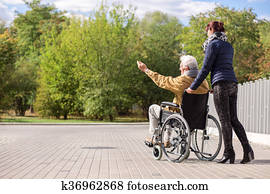 Disabled man and female caregiver