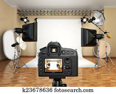 DSLR camera in photo studio with lighting equipment, softbox and