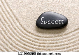 Black stone with the inscription Success