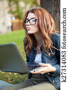 happy student girl writing to notebook at campus happy student girl writing to notebook at campus