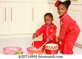Happy black children cooking