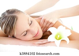 Relaxed woman receiving a back massage 