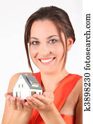 beauty girl in red dress with model of house