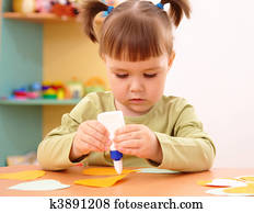 Little girl doing arts and crafts in preschool Little girl doing arts and crafts in preschool