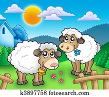 Two cute sheep behind fence Two cute sheep behind fence