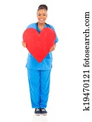 african nurse holding heart