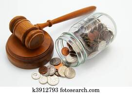 legal court gavel and money from a coin jar legal court gavel and money from a coin jar