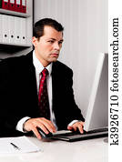 Businessman in office with computer
