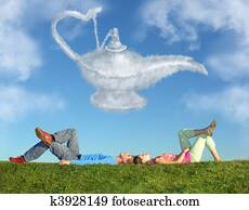 lying couple on grass and dream alladin lamp cloud collage