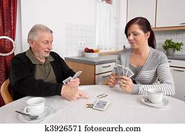 Wife playing with people in the free time with playing cards