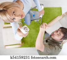 Woman changing light bulb