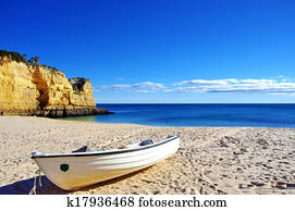Fishing boat in the sand. Algarve, Portugal. 