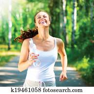 Running woman. Female Runner Jogging in a Park Running woman. Female Runner Jogging in a Park