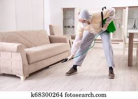 Pest control contractor working in the flat Pest control contractor working in the flat