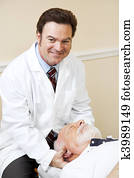 Handsome Chiropractor Working Handsome Chiropractor Working