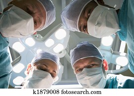 Low Angle View Of Four Surgeons