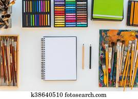 Painter workplace in order side view. Designer desk with drawing equipment. Home studio for artist