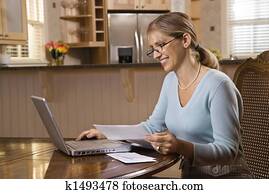 Woman on computer.