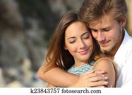 Couple in love hugging and feeling the romance Couple in love hugging and feeling the romance