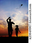 girl and father with kite at sunset girl and father with kite at sunset