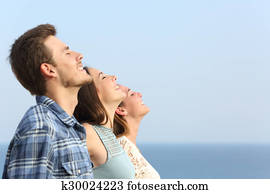 Group of friends breathing deep fresh air