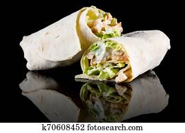 CHICKEN SALAD WRAP with reflection isolated on black background