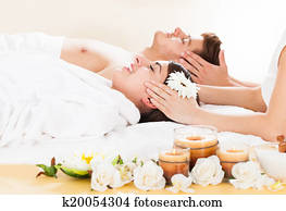 Couple Receiving Head Massage