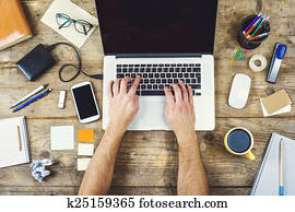 Desktop mix on a wooden office table.