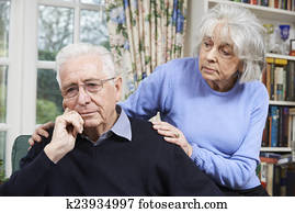 Woman Comforting Senior Man With Depression Woman Comforting Senior Man With Depression