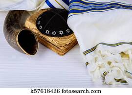 Yom Kippur, Rosh Hashanah Hashana jewish New Year, Shemini Atzeret Shmini Atzeret and Simchat Torah holiday concept with shofar traditional Israel's ram horn with religious holy prayer book Yom Kippur, Rosh Hashanah Hashana jewish New Year, Shemini Atzeret Shmini Atzeret and Simchat Torah holiday concept with shofar traditional Israel's ram horn with religious holy prayer book