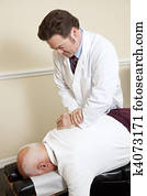 Senior Man with Chiropractor Senior Man with Chiropractor