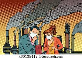 man and woman in a medical mask suffocating from industrial smok man and woman in a medical mask suffocating from industrial smok
