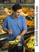 Man grocery shopping.