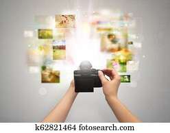 Hand captures life events with digital camera