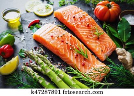 Fresh salmon fillet with aromatic herbs, spices and vegetables Fresh salmon fillet with aromatic herbs, spices and vegetables