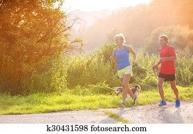 Senior couple running