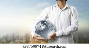 Glass globe in hand, Energy saving concept, Elements of image furnished by NASA Glass globe in hand, Energy saving concept, Elements of image furnished by NASA