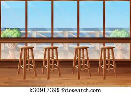 Inside of restaurant with stools and bar