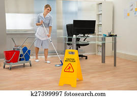 Maid Cleaning Floor In Office Maid Cleaning Floor In Office