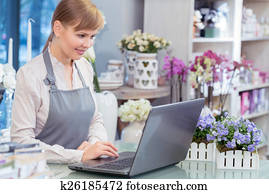 Small business entrepreneur florist in her store Small business entrepreneur florist in her store