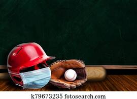 Baseball Helmet Wearing Mask With Chalkboard Background and Copy Space