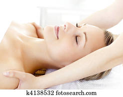Glad young woman having a massage 