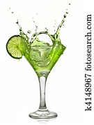 Green alcohol cocktail with splash and green lime isolated on white